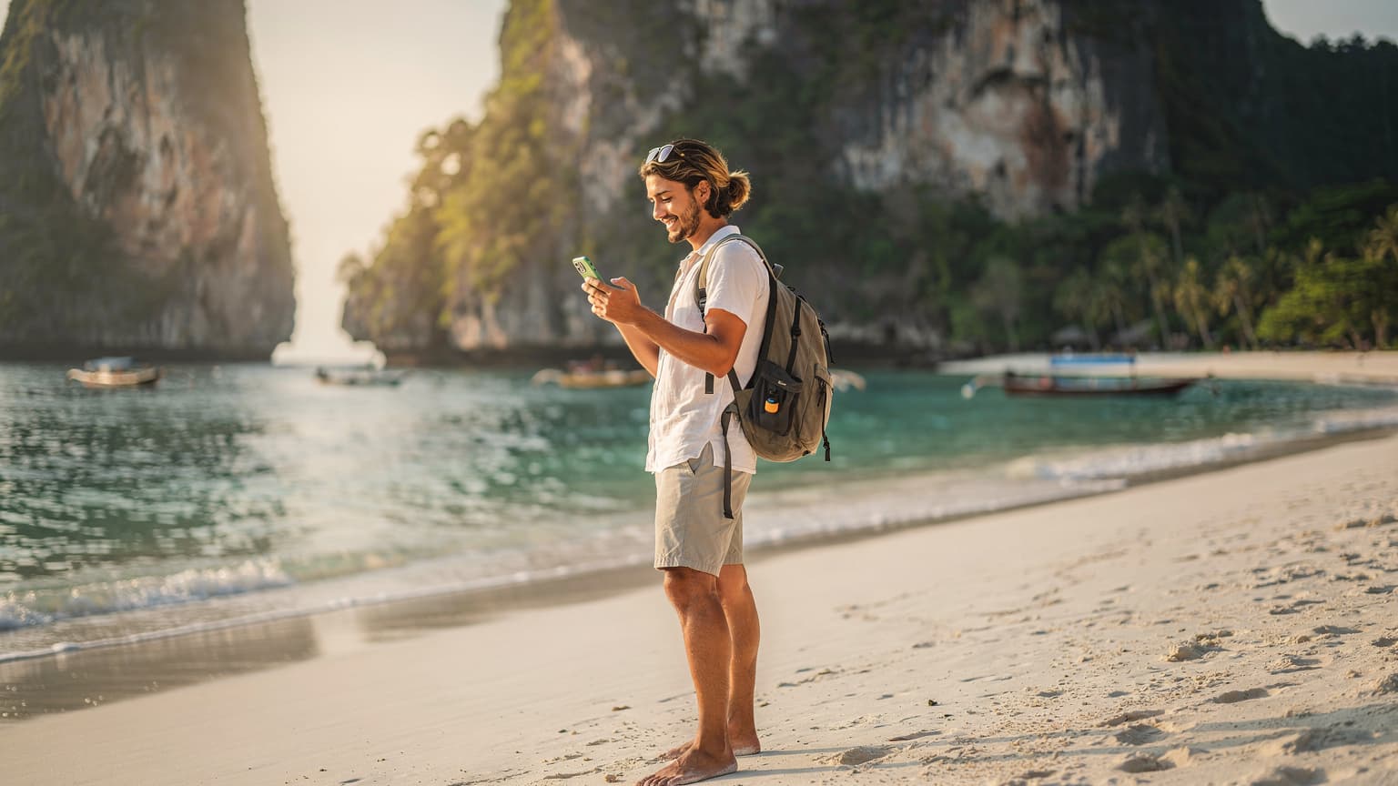 A tourist holding a smartphone in a beautiful Philippine landscape, such as a beach or rice terraces, illustrating digital connectivity and eSIM usage for travelers.