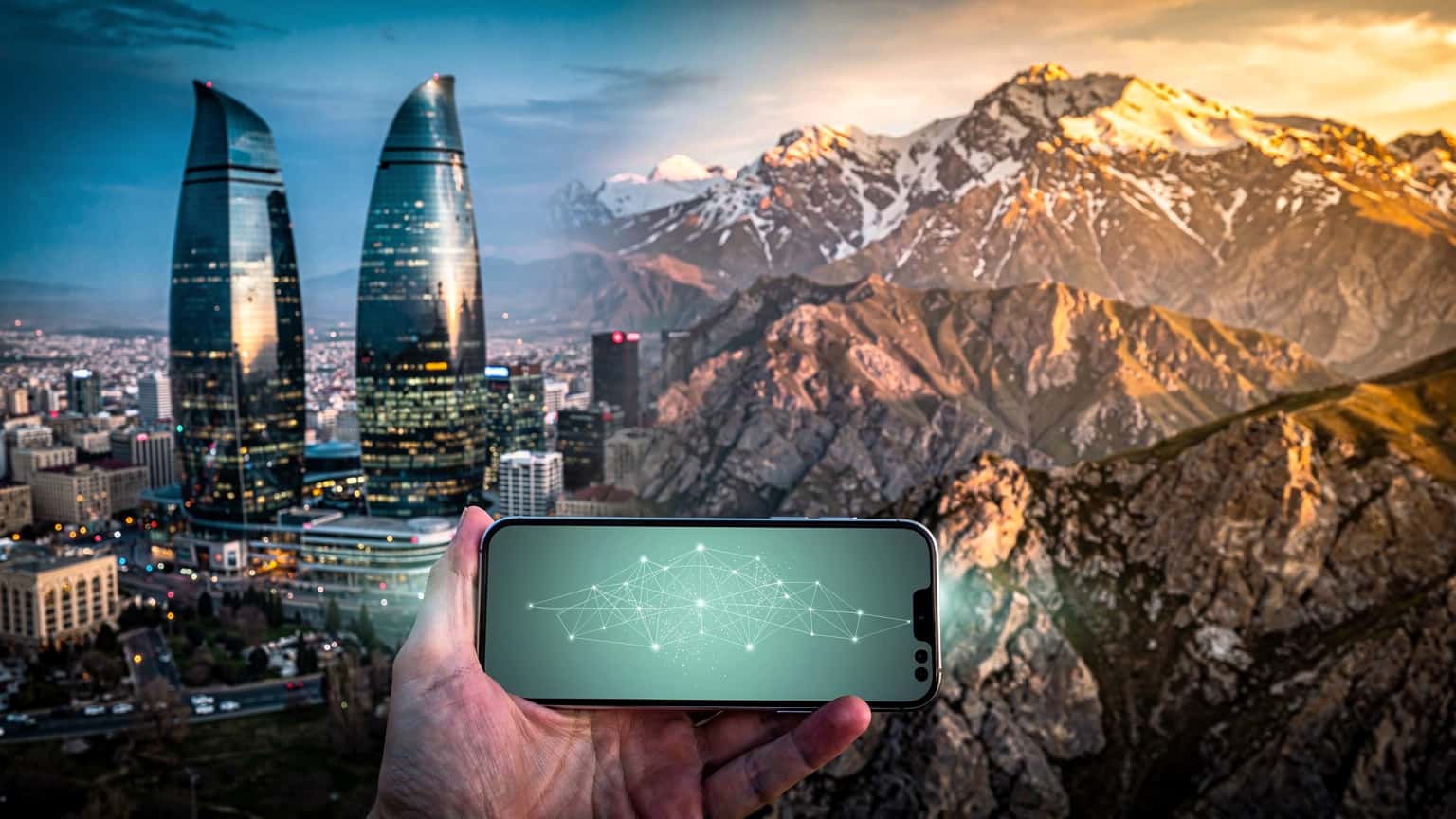 A photorealistic hero image for a travel/tech magazine, featuring a modern smartphone held against a backdrop split between the iconic Flame Towers of Baku and the majestic, snow-capped Caucasus Mountains in Azerbaijan, all under dramatic natural light.