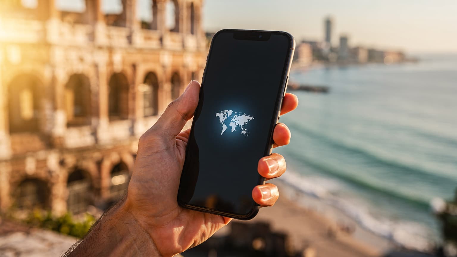 A hand holding a modern smartphone with a connectivity icon on screen, set against a blurred, sun-drenched international travel destination, symbolizing flexible global mobile connectivity.