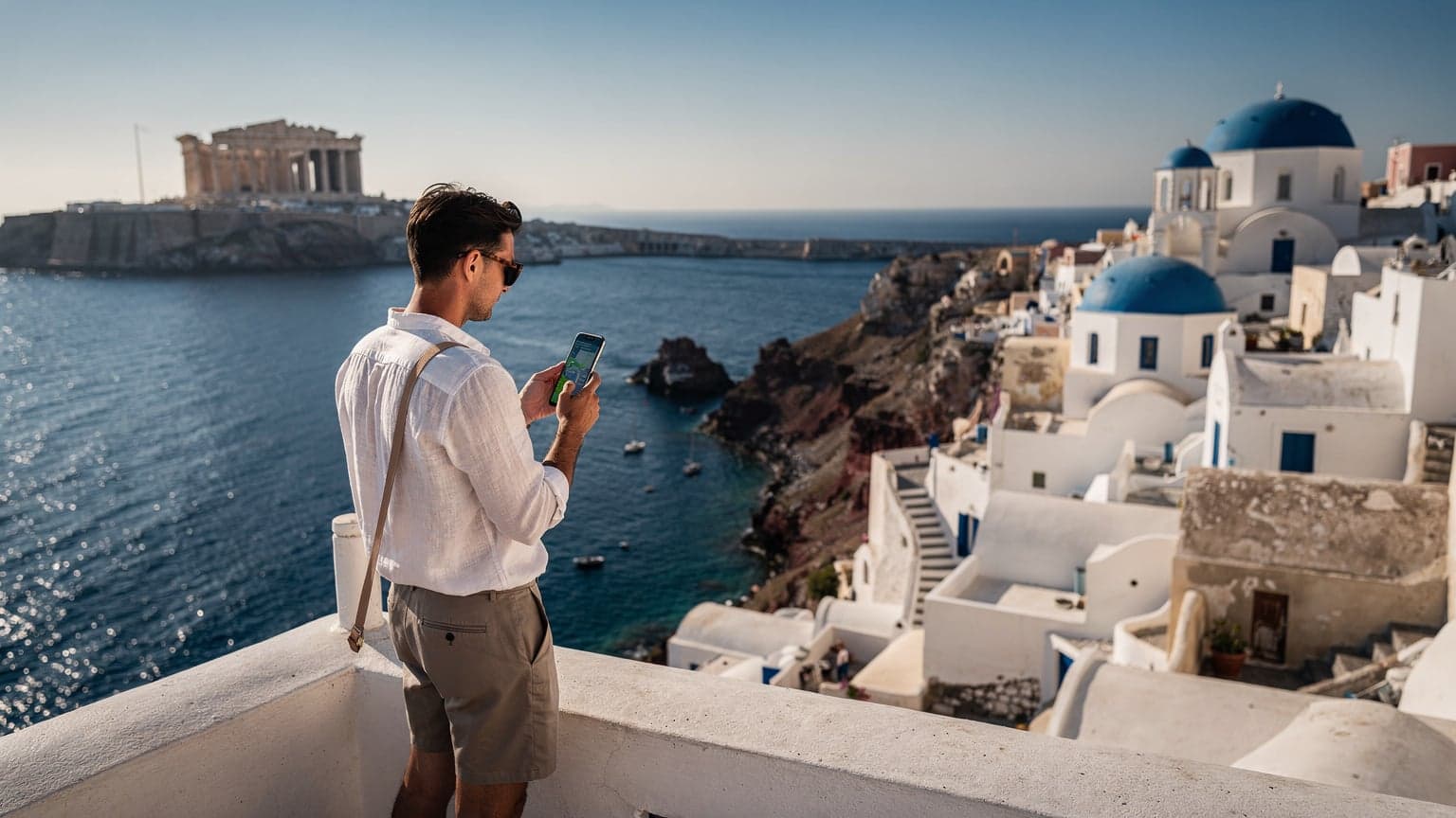 A person uses a smartphone on a sun-drenched terrace in Greece, with the Parthenon and iconic Cycladic architecture overlooking the Aegean Sea, symbolizing modern connected travel.